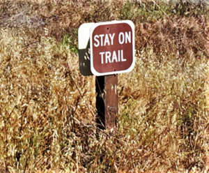 "Stay on trail" sign