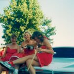 SDH3 Original Red Dress Run #1 Hares Primo-Donna, Bumps & Goulash (08/12/1988) first-ever Red Dress Run Del Mar California at hash start atop white limo hood